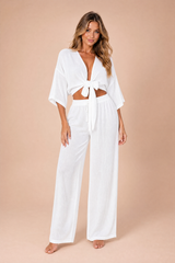 Set crop top annodato pantaloni larghi