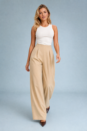 Pantalon beige taille haute jambes larges | Vue en mouvement | Lounelle Paris
