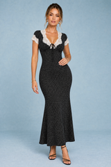 Vestito nero a pois con bordo di pizzo