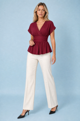 Blusa con scollo a V e vita cinta