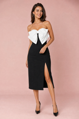 Vestito nero con nodo e spacco