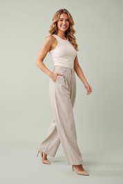 Pantalon beige large plissé | Vue de face | Lounelle Paris