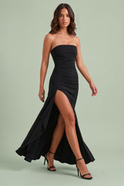 Robe longue noire froncée à fente asymétrique | Vue en mouvement | Lounelle Paris