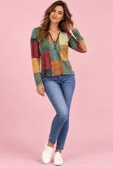 Top verde con stampa patchwork e zip