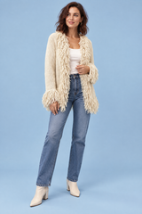 Cardigan color crema con frange