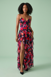 Robe longue noire asymétrique à manches cape et imprimé lys | Vue de face | Lounelle Paris