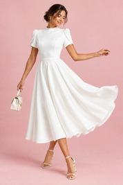 Robe midi blanche à col montant et manches bouffantes | Vue en mouvement | Lounelle Paris