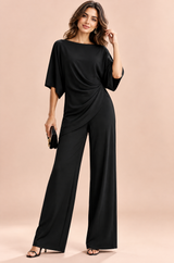 Completo nero con pantaloni palazzo a pieghe