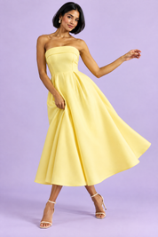 Robe midi patineuse bustier jaune | Vue en mouvement | Lounelle Paris