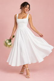 Robe midi blanche à fines bretelles et ourlet ample | Vue en mouvement | Lounelle Paris