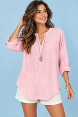 Top a righe con scollo a V rosa
