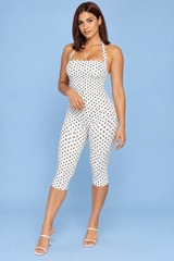 Tuta pantalone aderente bianca a pois