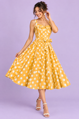 Abito midi giallo a pois, linea ad A e scollo a cuore