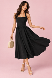 Robe midi patineuse noire à encolure américaine | Vue en mouvement | Lounelle Paris