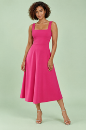 Robe midi rose vif à fines bretelles et jupe évasée | Vue de face | Lounelle Paris