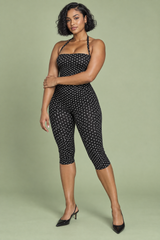 Tuta pantalone aderente nera a pois