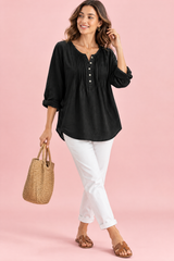 Camicia nera in cotone con scollo rotondo e pieghe