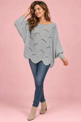 Maglione grigio oversize traforato con scollo a barca