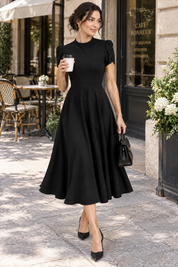Robe midi noire à col montant et manches bouffantes | Photo lifestyle | Lounelle Paris