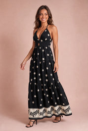Robe longue noire fleurie dos nu | Vue en mouvement | Lounelle Paris